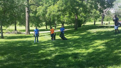 Volunteers picking up trash at a park